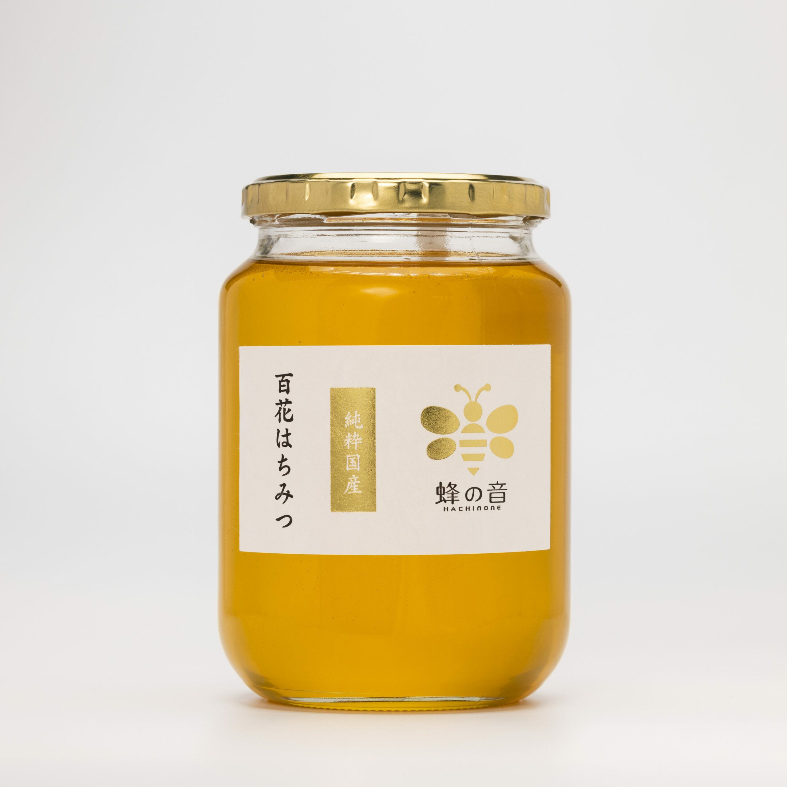 四季折々に咲く様々な花から採蜜し厳選した「国産百花はちみつ」の商品画像。時期や採蜜場所で風味が異なる、四季の恵みを感じるはちみつ。