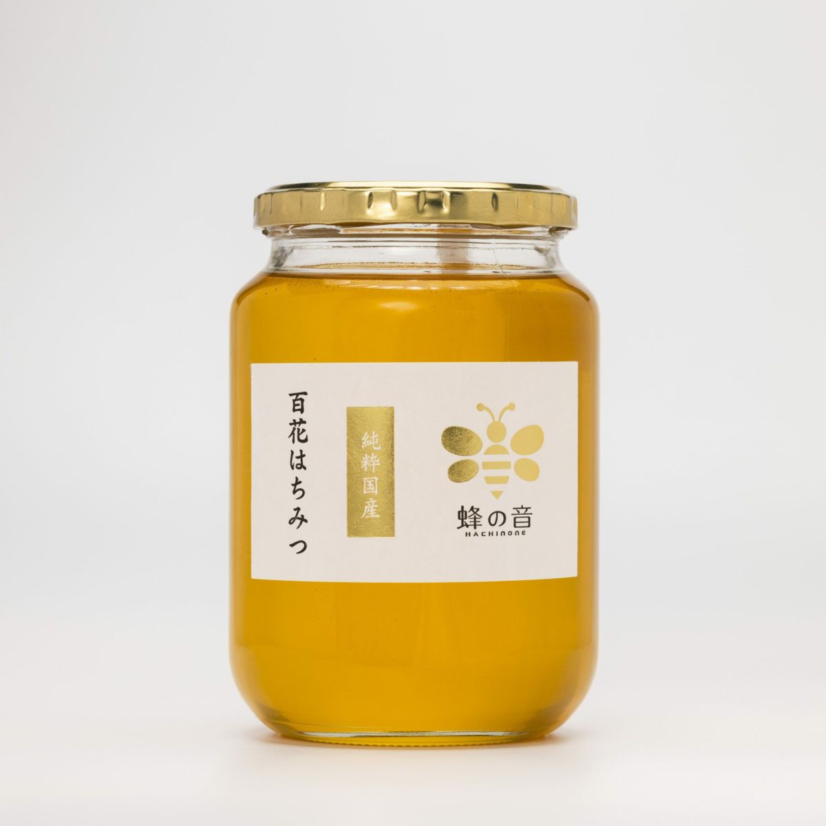 四季折々に咲く様々な花から採蜜し厳選した「国産百花はちみつ」の商品画像。時期や採蜜場所で風味が異なる、四季の恵みを感じるはちみつ。