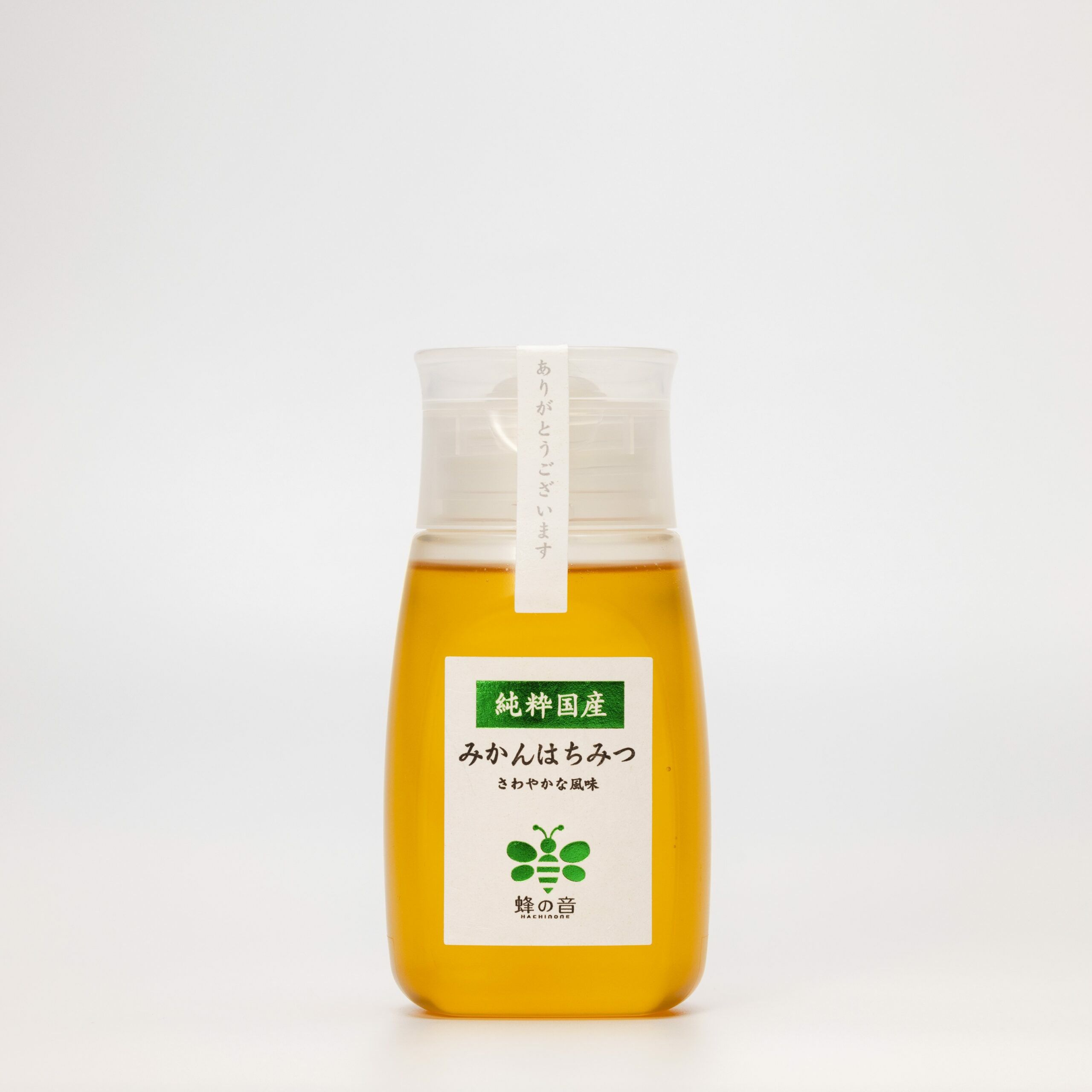 みかんの花を蜜源とした希少な「国産みかんはちみつ」の商品画像。柑橘系らしいフレッシュでフローラルな香りと、柔らかい甘さが特徴。