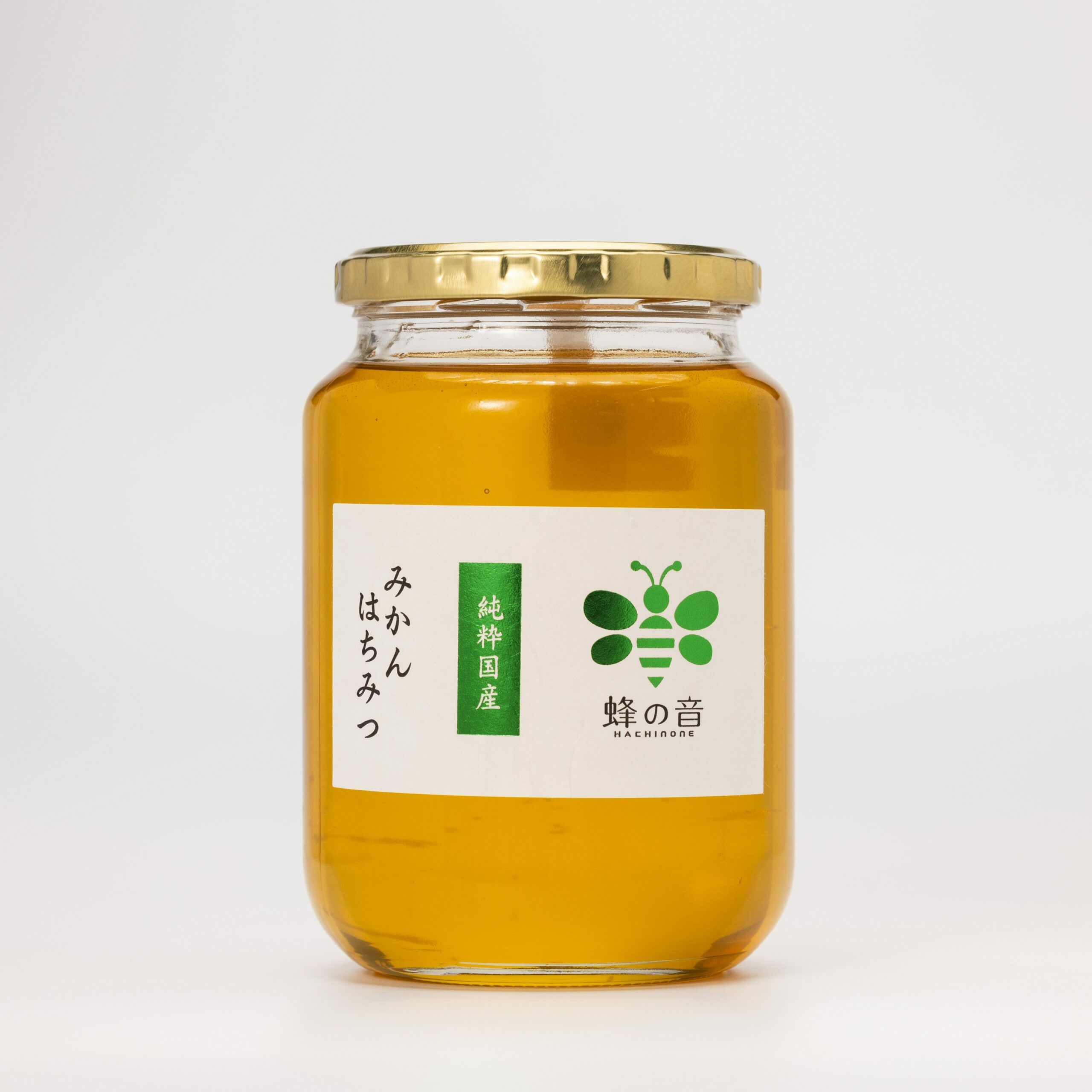 みかんの花を蜜源とした希少な「国産みかんはちみつ」の商品画像。柑橘系らしいフレッシュでフローラルな香りと、柔らかい甘さが特徴。