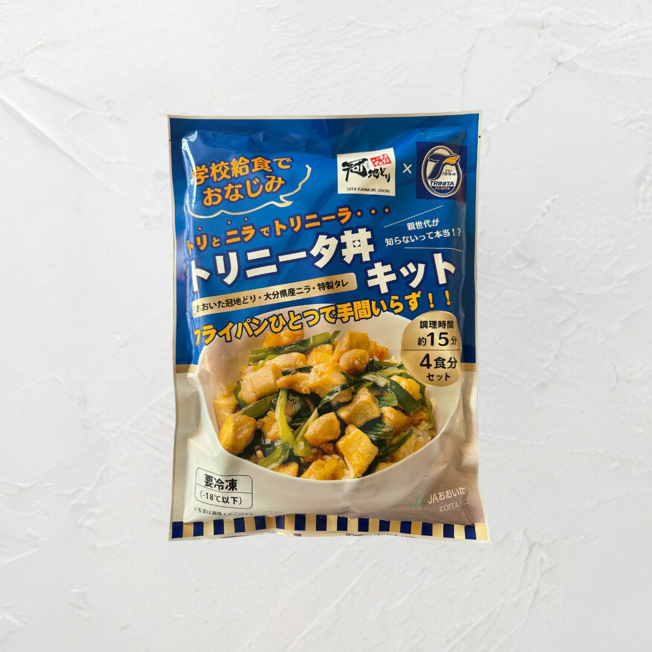大分トリニータの名にちなんだ、大分名物「トリニータ丼キット（4食分）」のパッケージ画像。地元のニラを美味しく食べられるよう考案された郷土食を自宅で再現。